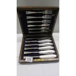An oak cased set of fish knives and forks.