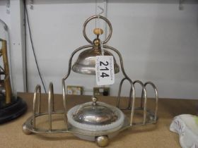 A retro silver plate toast rack incorporating conserve dish.