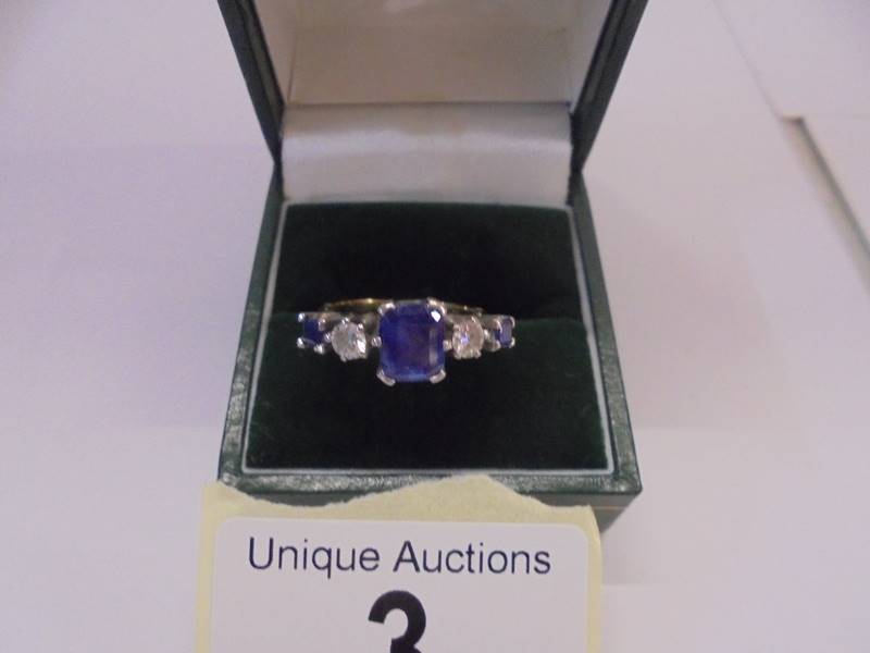 An 18ct gold sapphire and diamond ring, size J half, 4.5 grams.