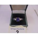 An 18ct gold sapphire and diamond ring, size J half, 4.5 grams.