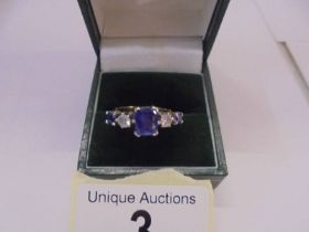 An 18ct gold sapphire and diamond ring, size J half, 4.5 grams.