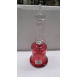 A cranberry glass bell.