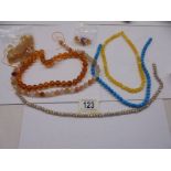A quantity of unfinished bead necklaces.