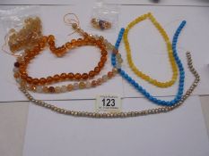 A quantity of unfinished bead necklaces.