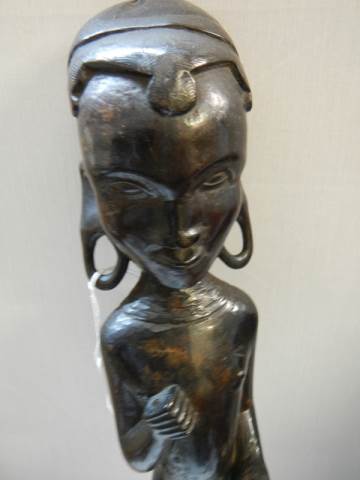 A carved wood tribal figure. - Image 2 of 2