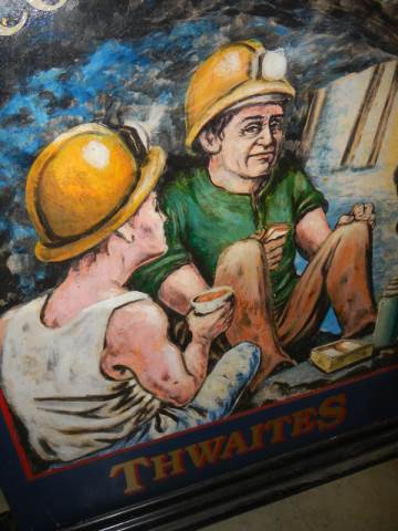 A 1980'S double sided hand painted & signed Thwaites Brewery pictorial pub sign 'Collier's Rest' - Image 2 of 3