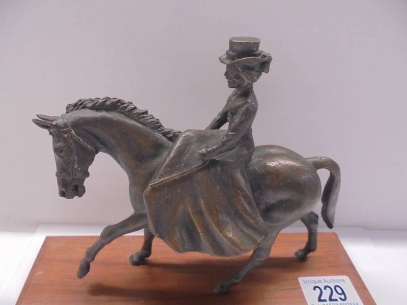 A bronze figure of a lady riding a horse side saddle, length 18cm, height 15.5 cm. - Image 2 of 3