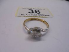 A vintage diamond three stone ring hallmarked for Birmingham in an 18ct gold twist design shank,