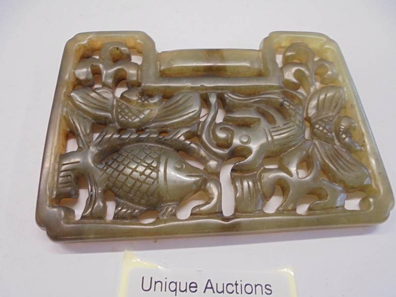 A Chinese jade lock shaped carved pendant depicting fish, 92 x 67 x 6 mm. - Image 2 of 3