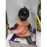 A vintage black baby doll.