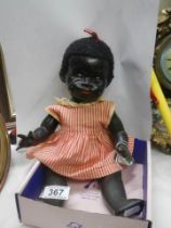 A vintage black baby doll.