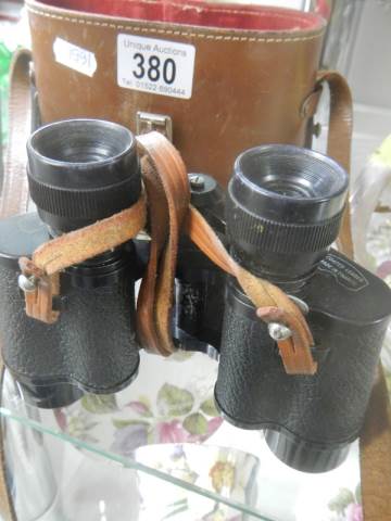 A cased pair of French Denhill 8 x 30 binoculars, J A Dave & son, London.