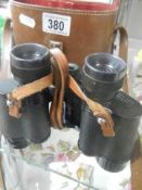 A cased pair of French Denhill 8 x 30 binoculars, J A Dave & son, London.