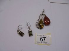 A silver and amber pendant together with a pair of silver and amber earrings, (925).