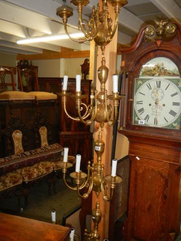 A set of four brass triple lamp wall lights, COLLECT ONLY.