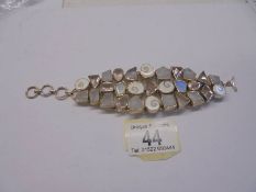 A silver stone set three row bracelet.