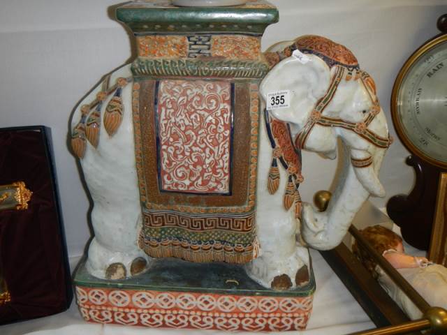 A late 19th/early 20th century ceramic elephant garden seat/pot stand, COLLECT ONLY.