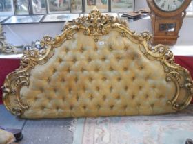 A mid 20th century gilded and deep buttoned head board, COLLECT ONLY.