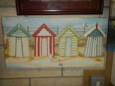 An oil on canvas featuring beach huts, signed Janice McGlaine. COLLECT ONLY.