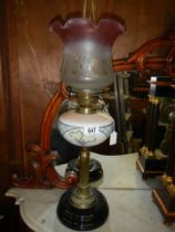 A Victorian oil lamp with brass column and glass font, COLLECT ONLY.