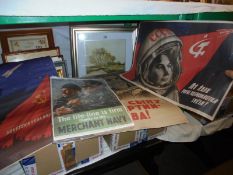 Three Russian posters and a Merchant Navy poster.