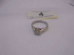 An 18ct white and yellow gold ring set single stone diamond, size I, 2.7 grams.