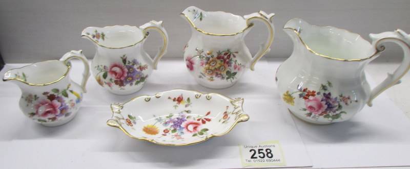 Four Royal Albert 'Posies' graduated jugs and a pin dish.