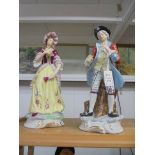 A pair of 19th century continental porcelain figures.