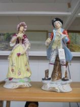 A pair of 19th century continental porcelain figures.