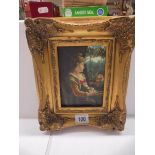 A gilt framed study of a lady.