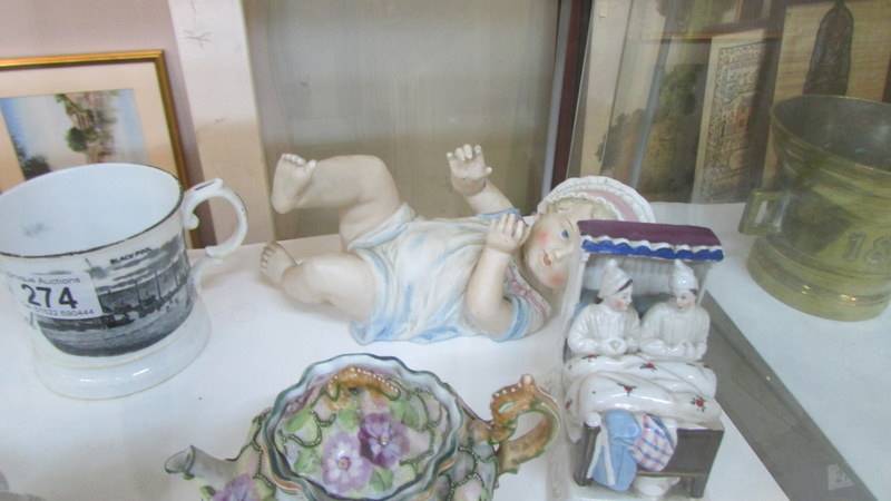A mixed lot including piano baby, 2 Victorian fairings, small teapot and a Blackpool mug. - Image 4 of 4