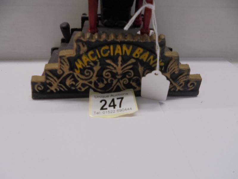 A cast iron magician money bank. - Image 3 of 3