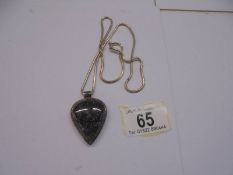 A white metal grey stone pendant on a silver chain, 53 cm long.