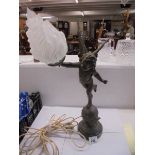 A table lamp on marble base featuring an cherub on a globe complete with flame shade, COLLECT ONLY.