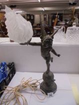 A table lamp on marble base featuring an cherub on a globe complete with flame shade, COLLECT ONLY.