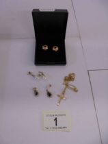 A pair of 18ct (575) gold earrings, a pair of 9ct gold earrings, a 9ct gold cross on chain (2.2 g)