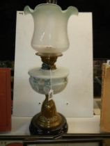 A Victorian oil lamp with painted glass font and later shade, COLLECT ONLY.