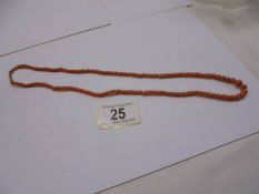 A vintage coral necklace with 9ct gold stamped clasp.