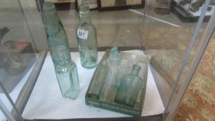 A quantity of old glass bottles, some a/f.