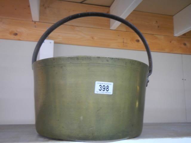 A large brass jam pan.