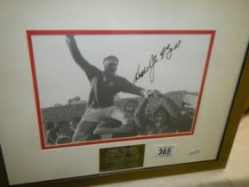 A framed and glazed signed photograph featuring rugby by the Times. COLLECT ONLY.