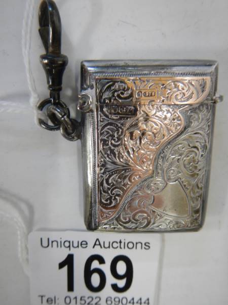 A hall marked silver vesta case with gold (375) mounts, in good condition. - Image 3 of 6