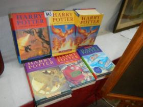 A collection of six Harry Potter books.