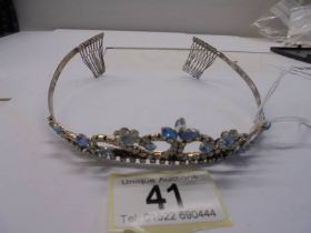 A blue and white stone tiara in white metal,