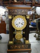 A French four pillar mantel clock, complete. COLLECT ONLY.