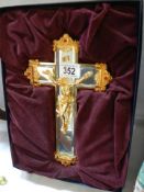 A boxed bevelled glass and gilt Crucifix.