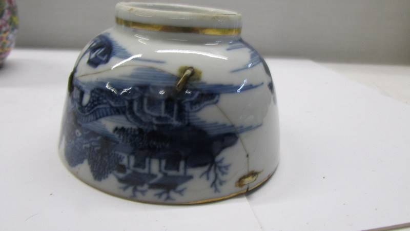 A pair of 19th century Chinese tea bowls (one with early stapled repair) & a miniature Chinese vase. - Image 3 of 8