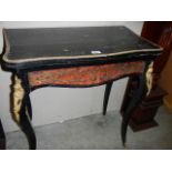 An early Victorian bouille fold over games table in need of restoration, COLLECT ONLY.
