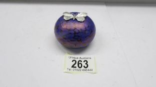 An iridescent paperweight with silver butterfly by K. Heaton, signed, Height 4.5cm Diameter 6cm