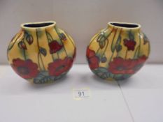 A pair of Old Tupton ware poppy vases.